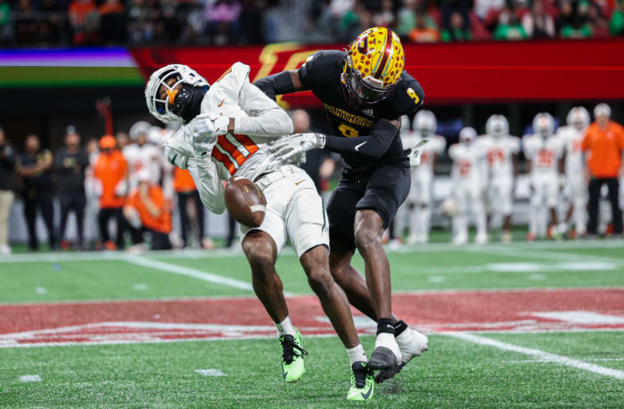 Perry's Maurice Hayes Jr. knocks the ball from Stockbridge receiver Ryan Johnson (10) during the Georgia 4A state championship game. 12/12/2023.